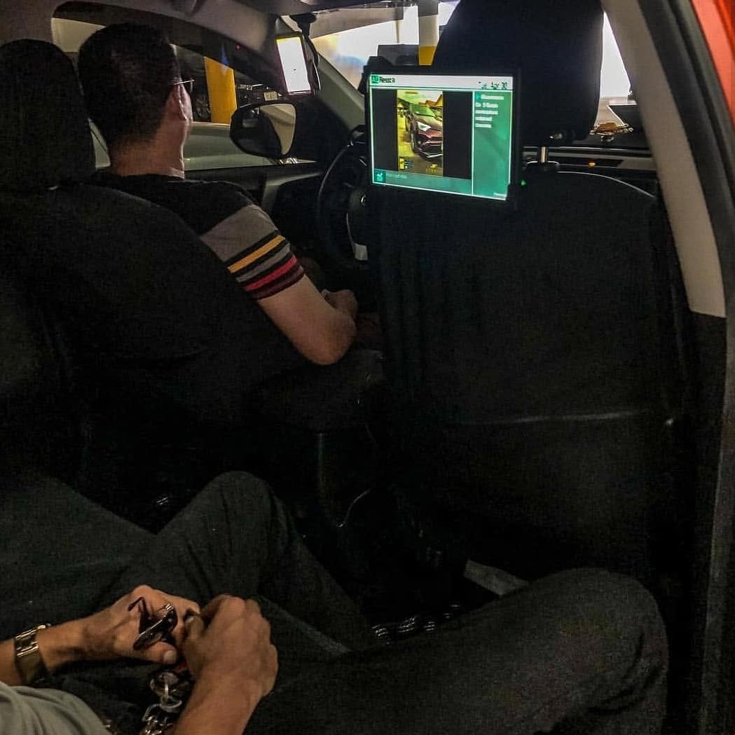 Passenger point of view of an AdResst headrest display during the 2019–2020 Guam smart-display deployment